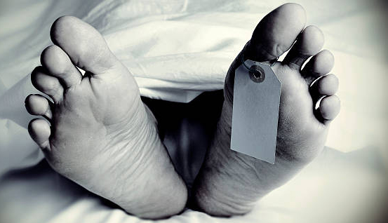 dead body with a blank toe tag, in monochrome