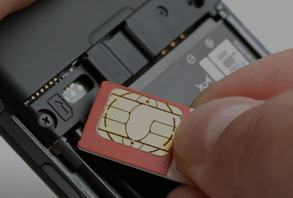 sim-card-being-placed-into-a-mobile-phone-copy