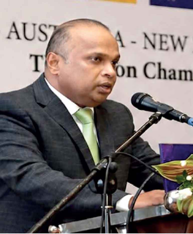 Sri Lankan and Australian business professionals reviewing technology and supply-chain information in a modern meeting room