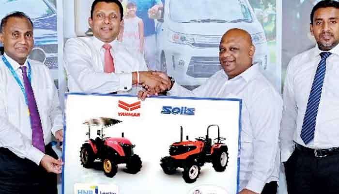 HNB powers agri-machinery leasing with Lanka Commercial Trading collaboration