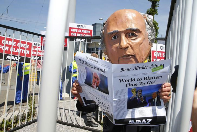 Activists from advocacy group Avaaz demonstrate near the Hallenstadion where the 65th FIFA Congress will take place in Zurich