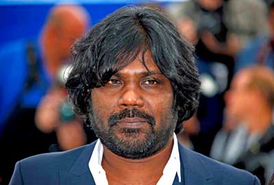 Cast member Jesuthasan Antonythasan poses during a photocall for the film "Dheepan" in competition at the 68th Cannes Film Festival in Cannes