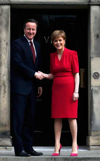 Scotland's First Minister Nicola Sturgeon greets Britain's Prime Minister David Cameron as he arrives for their meeting in Edinburgh