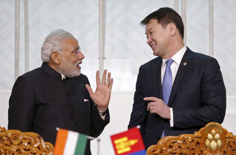 Mongolia's Prime Minister Saikhanbileg talks to India's Prime Minister Modi as they attend a signing ceremony at the national parliament building in Ulan Bator