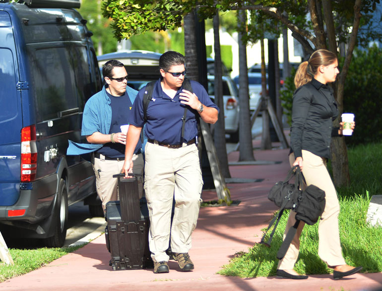 FBI agents prepare to enter the offices of CONCACA in Miami Beach