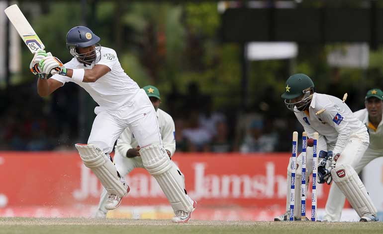 Sri Lanka's Chandimal is bowled out by Pakistan's Shah during the second day of their second test cricket match against Pakistan in Colombo