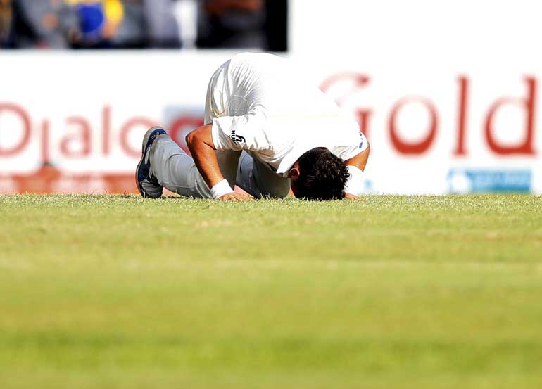 Pakistan's Shah celebrates after taking the wicket of Sri Lanka's Kaushal during the second day of their second test cricket match against Pakistan in Colombo