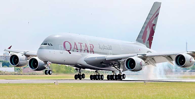 A Qatar Airways Airbus A380, the world's largest jetliner touches down at Le Bourget airport one day before the opening of the 51st Paris Air Show
