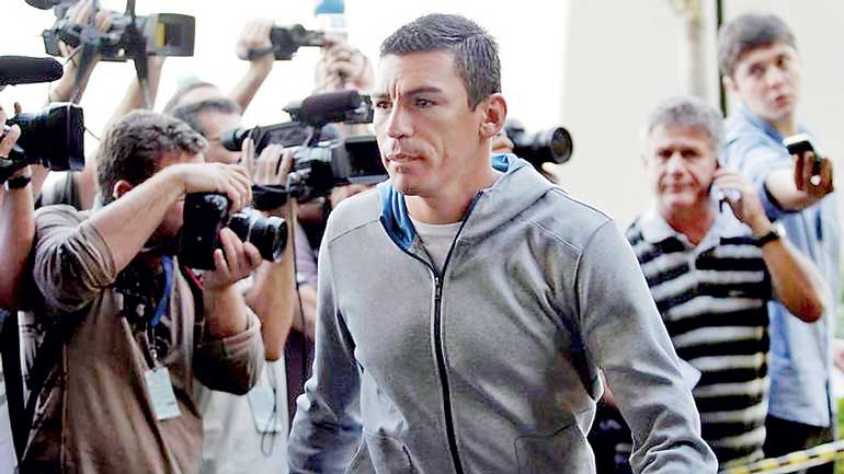 Brazil's soccer player Lucio arrives at a hotel to begin preparations for the Copa America soccer championship in Rio de Janeiro