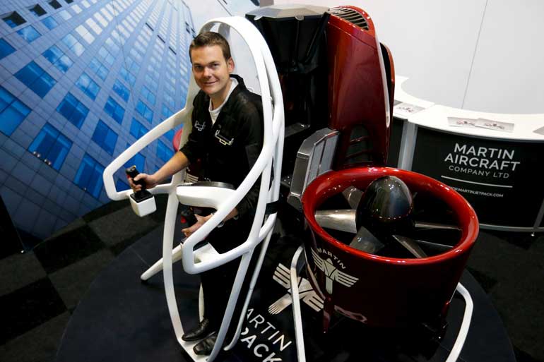 Martin Aircraft test pilot Michael Van Der Vliet is strapped into his company's jetpack during the 51st Paris Air Show at Le Bourget airport near Paris