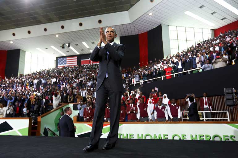 Obama thanks the crowd as he departs after his remarks at an indoor stadium in Nairobi