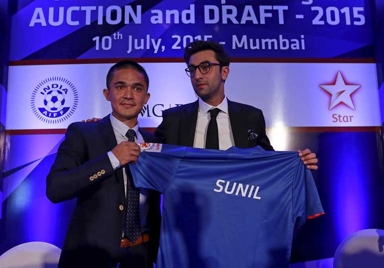 Mumbai City FC player Sunil Chhetri poses with the team co-owner and Bollywood actor Ranbir Kapoor at a news conference during the domestic player auction and draft for the Indian Super League in Mumbai