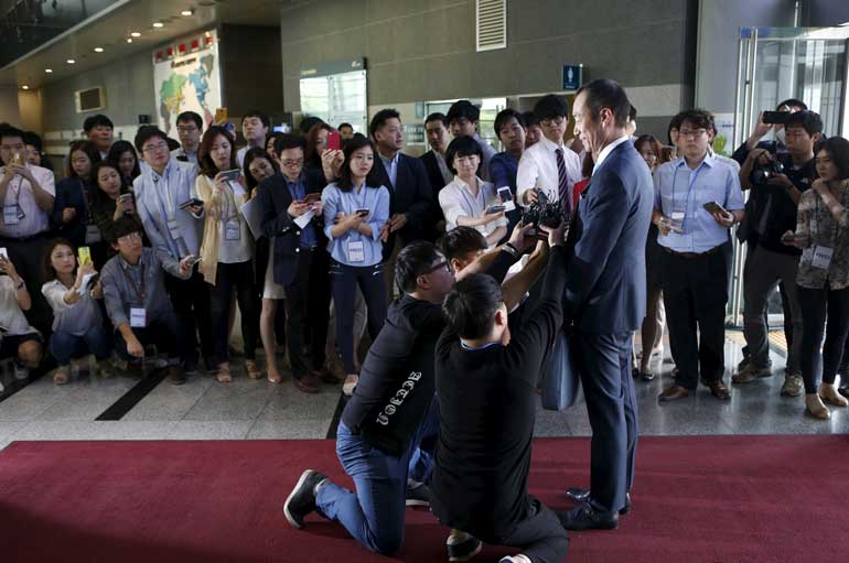 Choi, President and CEO at Samsung C&T Corporation, stands in front of media upon his arrival at a general meeting of stockholders in Seoul