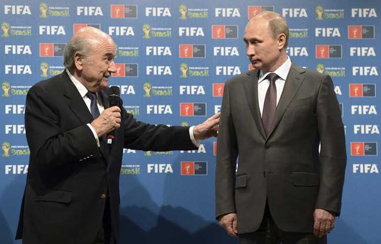 Russian President Putin and FIFA President Blatter take part in the official hand over ceremony for the 2018 World Cup, in Rio de Janeiro