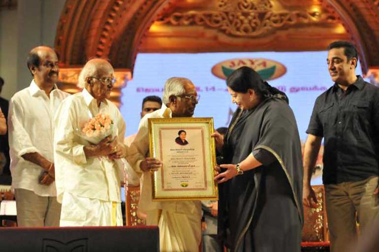 The-Chief-Minster-greets-the-recipients-of-the-award-MSV-and-TKR-as-Rajnikanth-and-Kamal-Haasan-look-on
