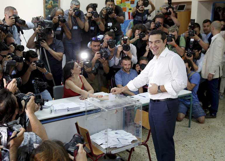 Greek Prime Minister Alexis Tsipras votes in national referendum at a polling station in Athens
