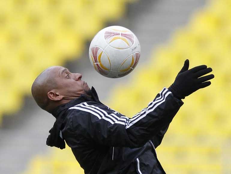 Anzhi Makhachkala's team director Carlos bounces the ball during a training session at the Luzhniki stadium in Moscow