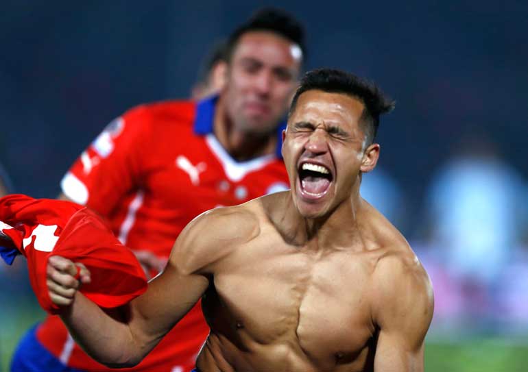 Chile's Alexis Sanchez celebrates after scoring the winning penalty kick in their Copa America 2015 final soccer match against Argentina at the National Stadium in Santiago