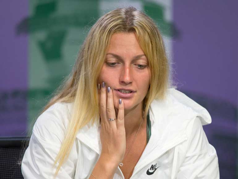 Defending champion Petra Kvitova of Czech Republic attends a news conference after losing her match against Serbia's Jelena Jankovic at the Wimbledon Tennis Championships in London