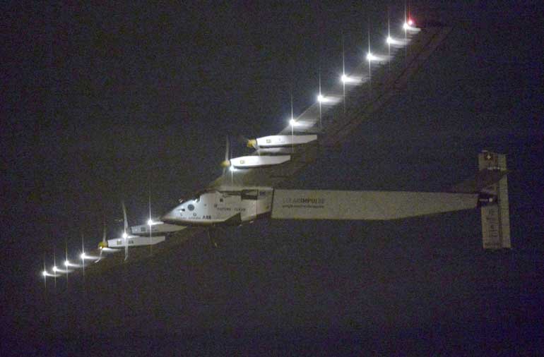 Solar Impulse 2, a solar powered airplane attempting a round-the-world flight, flies over Nagoya Airport after taking off from the airport to Hawaii, at Toyoyama town near Nagoya, central Japan