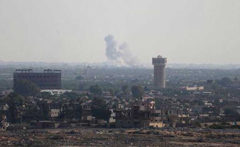 Smoke rises in Egypt's North Sinai as seen from the border of southern Gaza Strip with Egypt