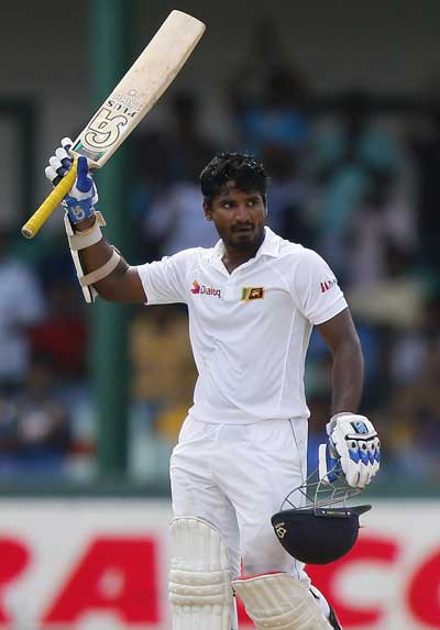 Sri Lanka's Perera celebrates his half century during the third day of their third and final test cricket match against India in Colombo