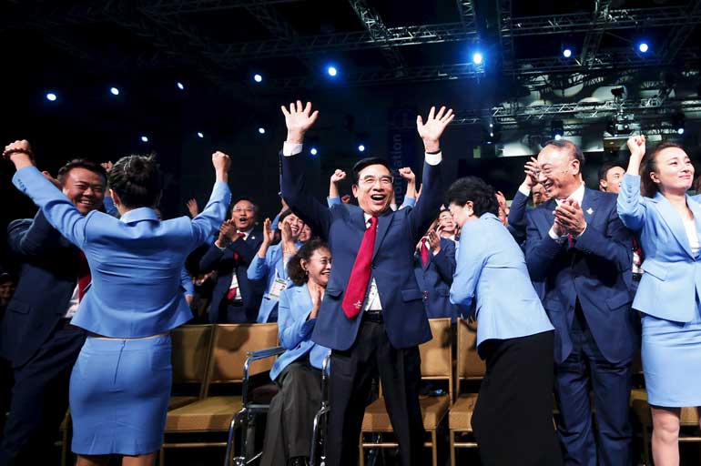 Beijing's Mayor and President of the Beijing 2022 delegation Wang Anshun celebrates after Beijing was awarded the 2022 Winter Olympic Games, defeating Almaty in the final round of voting, during the 128th IOC session in Kuala Lumpur