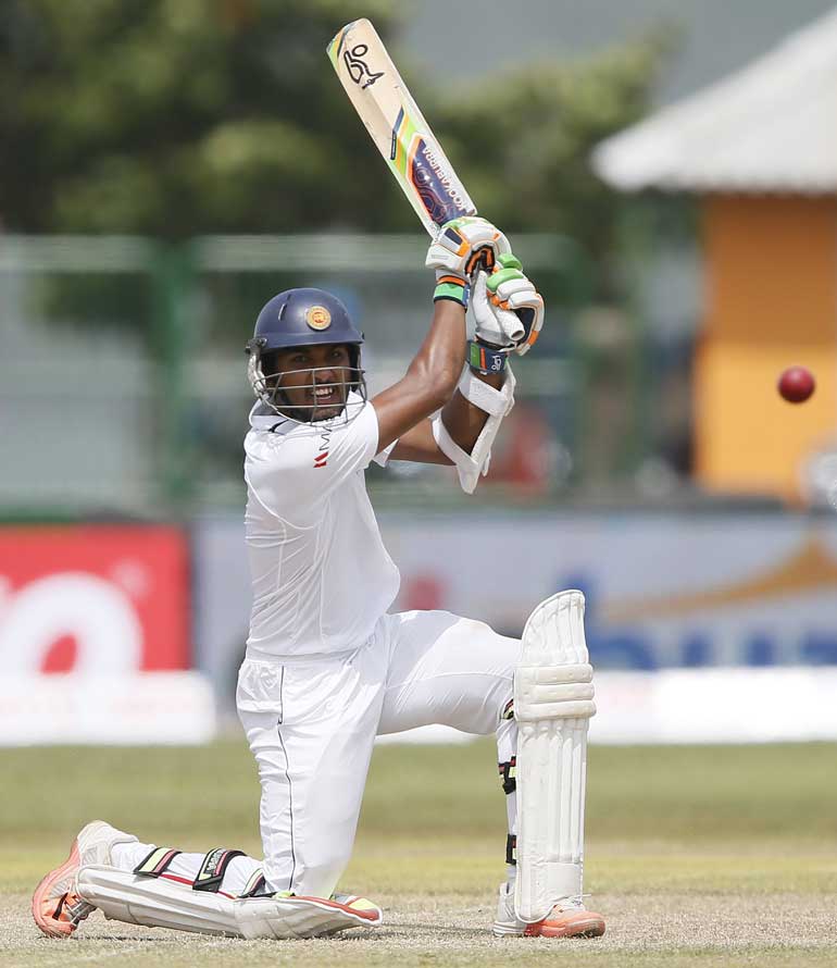 Sri Lanka's Chandimal plays a shot during the first day of their first test cricket match against India in Galle