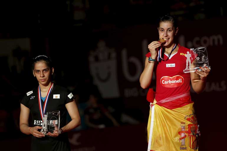 Spain's Carolina Marin and India's Saina Nehwal pose during trophy presentation at BWF World Championships in Jakarta, Indonesia