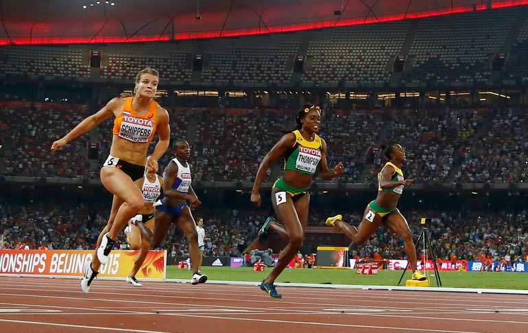 Dafne Schippers of the Netherland runs to win the women's 200m final ahead of Elaine Thompson of Jamaica during the 15th IAAF World Championships at the National Stadium in Beijing