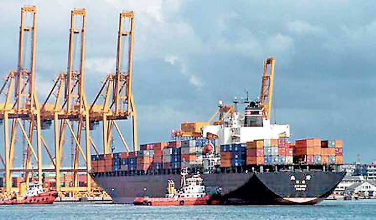 A tug boat (C) pushes the Japanese container ship