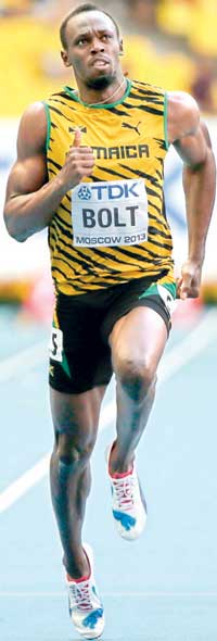 File photo of Bolt of Jamaica competing in the men's 100 metres semi-final heat event during the IAAF World Athletics Championships at the Luzhniki stadium in Moscow