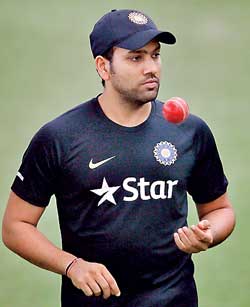 India's Sharma tosses a ball during a practice session ahead of their test cricket series against Sri Lanka, in Colombo