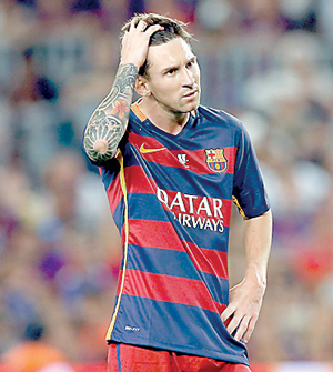 Barcelona's Lionel Messi gestures against Athletic Bilbao during their Spanish Super Cup second leg soccer match at Camp Nou stadium in Barcelona