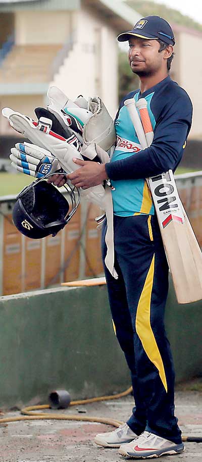 Sri Lanka's Kumar Sangakkara leaves a practice session after it was interrupted by rain, ahead of their first test cricket match against India, in Galle