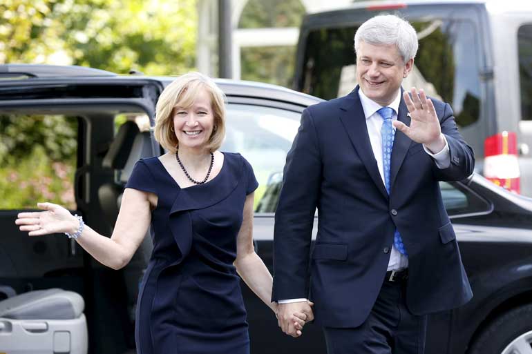 Canada's Prime Minister Harper and his wife arrive at Rideau Hall in Ottawa