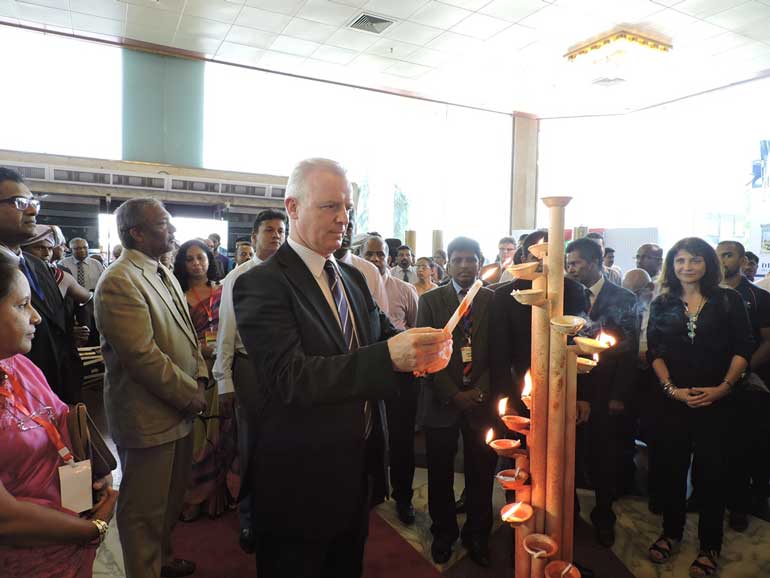 Kevin-O'Leary---CEO,-Serendib-Flour-Mills-lighting-ceremonial-oil-lamp-at-Pro-Food-Pro-Pack-Exhibition