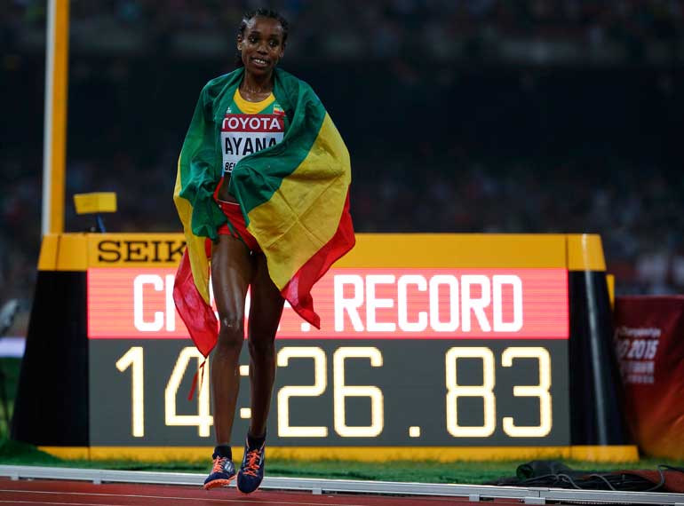 Ayana of Ehtiopia reacts after winning the women's 5000m event during the 15th IAAF World Championships at the National Stadium in Beijing