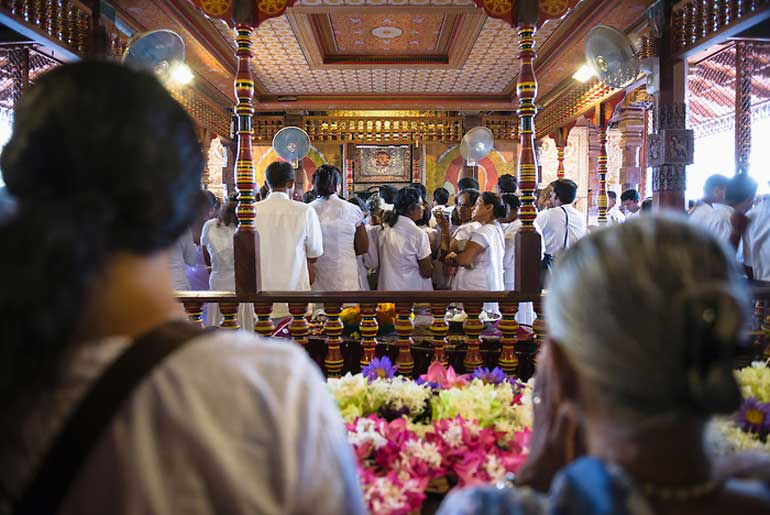 Pilgrims praying at the Temple of the Sacred Tooth Relic (Temple of the Tooth, Sri Dalada Maligawa) in Kandy, Sri Lanka, Asia