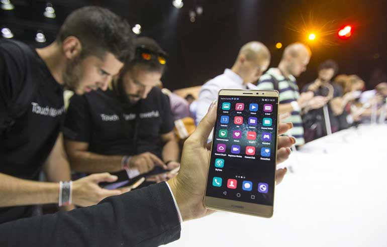 Journalists inspect the new smartphone Huawei Mate S ahead the of the IFA Electronics show in Berlin