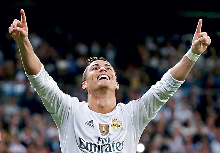 Real Madrid's Ronaldo celebrates his second goal during their Champions League soccer match against Shakhtar Donetsk at Santiago Bernabeu stadium in Madrid