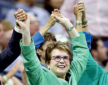 Tennis great Billie Jean King holds hands with other attendees as Serena Williams of the U.S. faces her sister and compatriot Venus Williams in their quarterfinals match at the U.S. Open Championships tennis tournament in New York