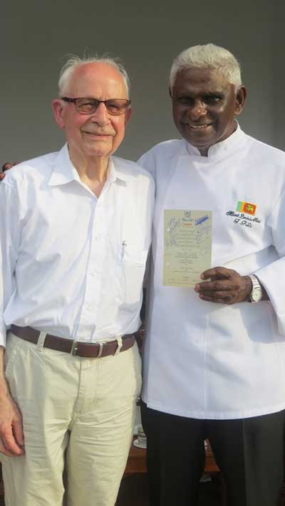 Gerard-Janssen-(left)-with-Chef-Publis-Silva,-holding-one-of-the-old-menus