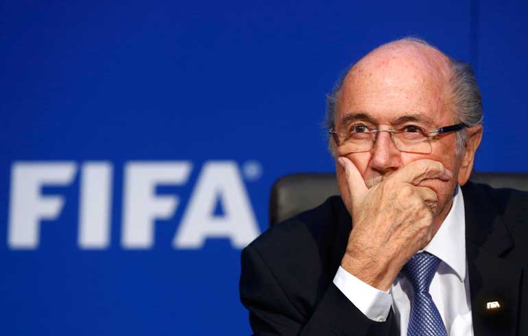 File photo of FIFA President Blatter reacting during a news conference after the Extraordinary FIFA Executive Committee Meeting at the FIFA headquarters in Zurich