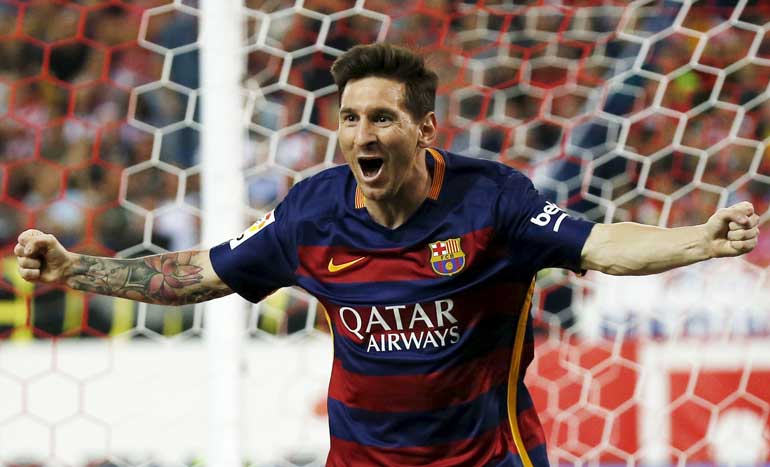 Barcelona's Messi celebrates after scoring a goal against Atletico Madrid during their Spanish first division soccer match at Vicente Calderon stadium in Madrid