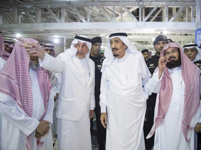 Saudi King Salman bin Abdulaziz arrives to the scene where a crane collapsed in the Grand Mosque in the Muslim holy city of Mecca