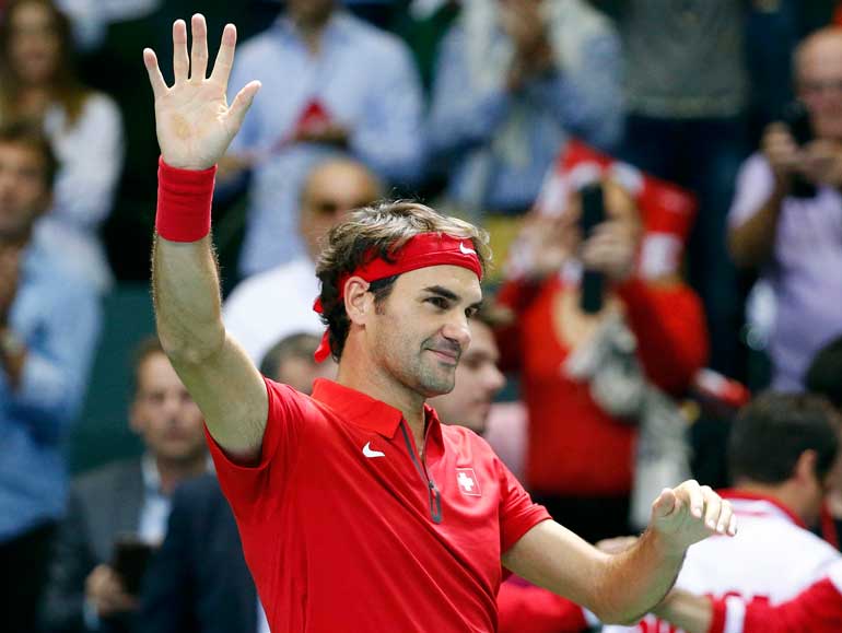 Switzerland's Federer reacts after winning his Davis Cup World Group play-off tennis match against de Bakker of the Netherlands in Geneva