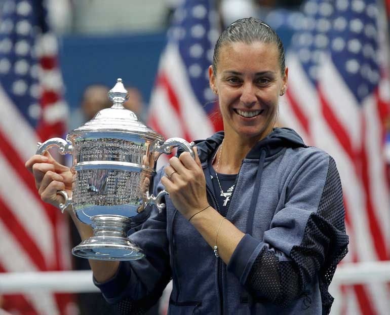 Pennetta of Italy holds the U.S. Open Trophy after defeating compatriot Vinci in their women's singles final match at the U.S. Open Championships tennis tournament in New York