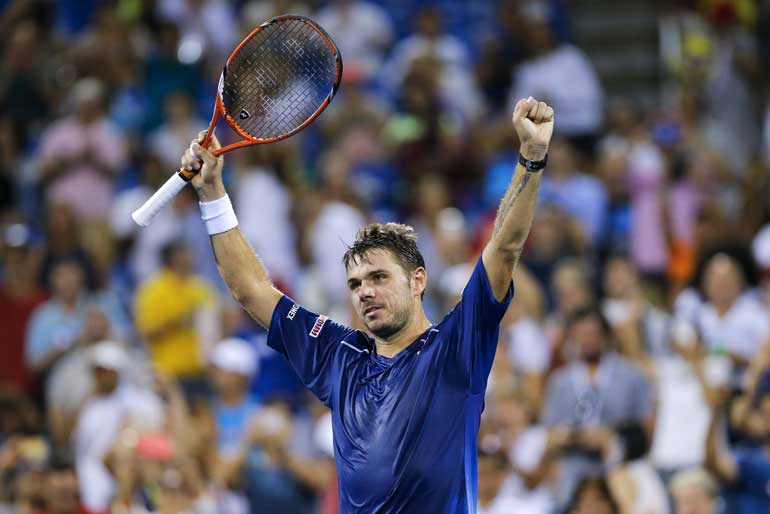 Wawrinka of Switzerland celebrates his victory over Anderson of South Africa during their quarterfinals match at the U.S. Open Championships tennis tournament in New York