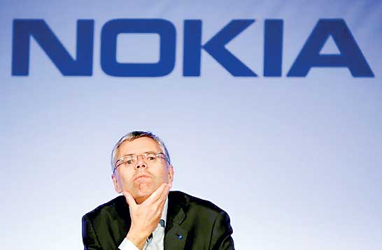 Michel Combes attends a news conference with Nokia in Paris